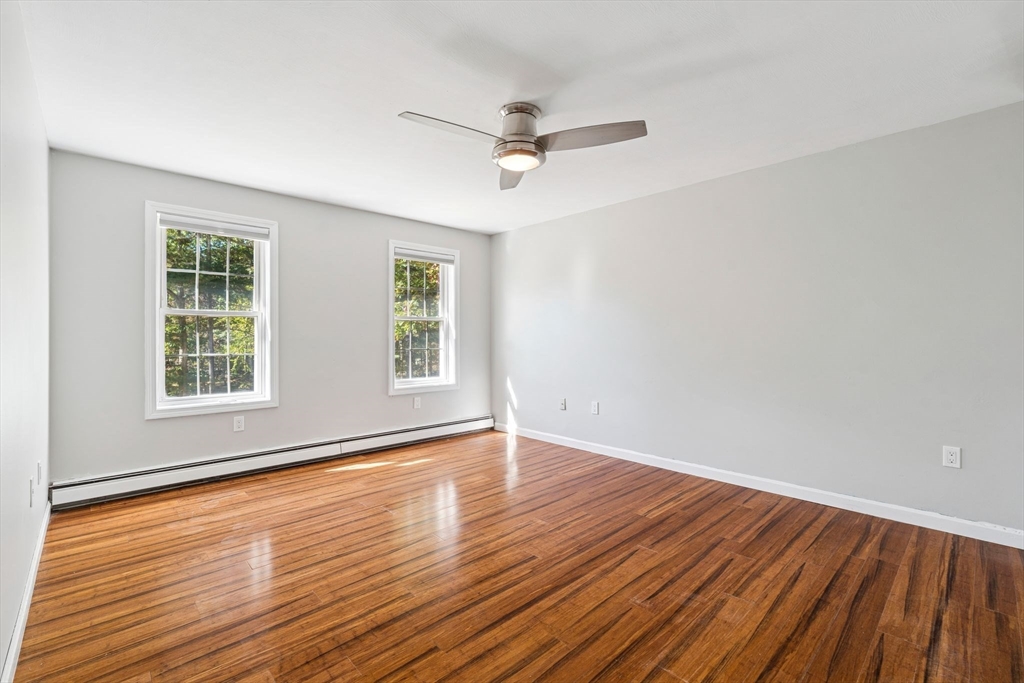 16 Captain Danforth Lane Amherst, NH 03031 - Photo 17 of 30 wooden floor in an empty room with a window