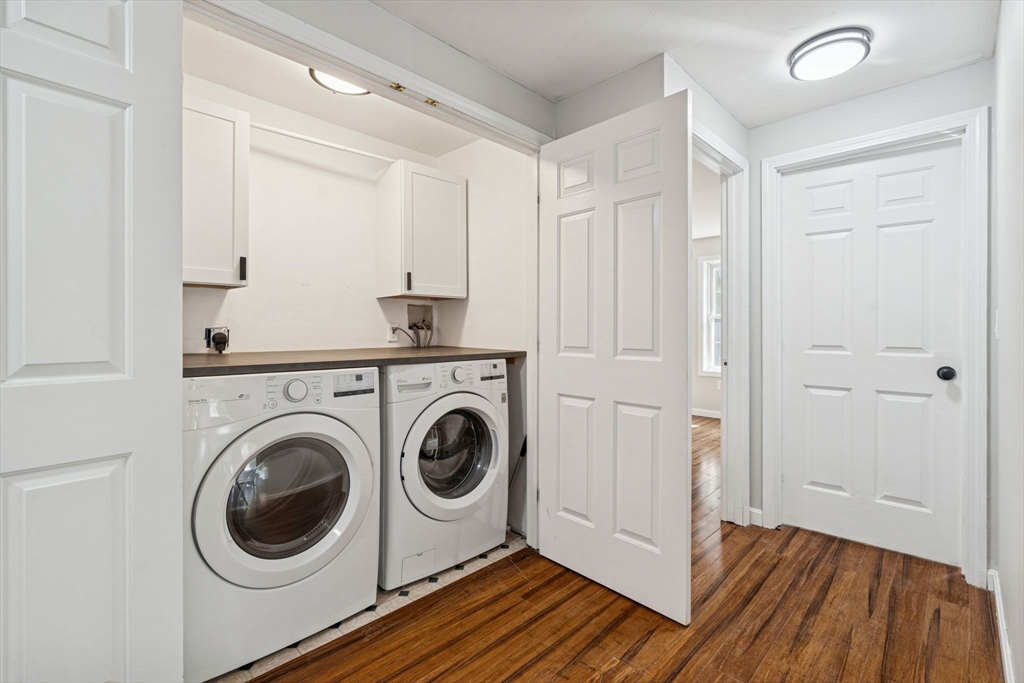 16 Captain Danforth Lane Amherst, NH 03031 - Photo 26 of 30 a view of a storage and utility room with washer and dryer