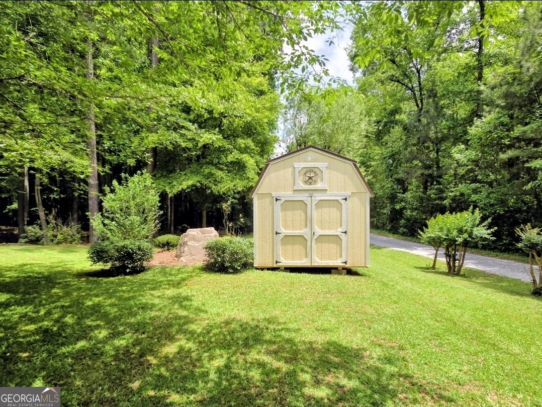21 Baskin Heights Path Temple, GA 30179 - Photo 37 of 44 a view of a garden with a house in the background
