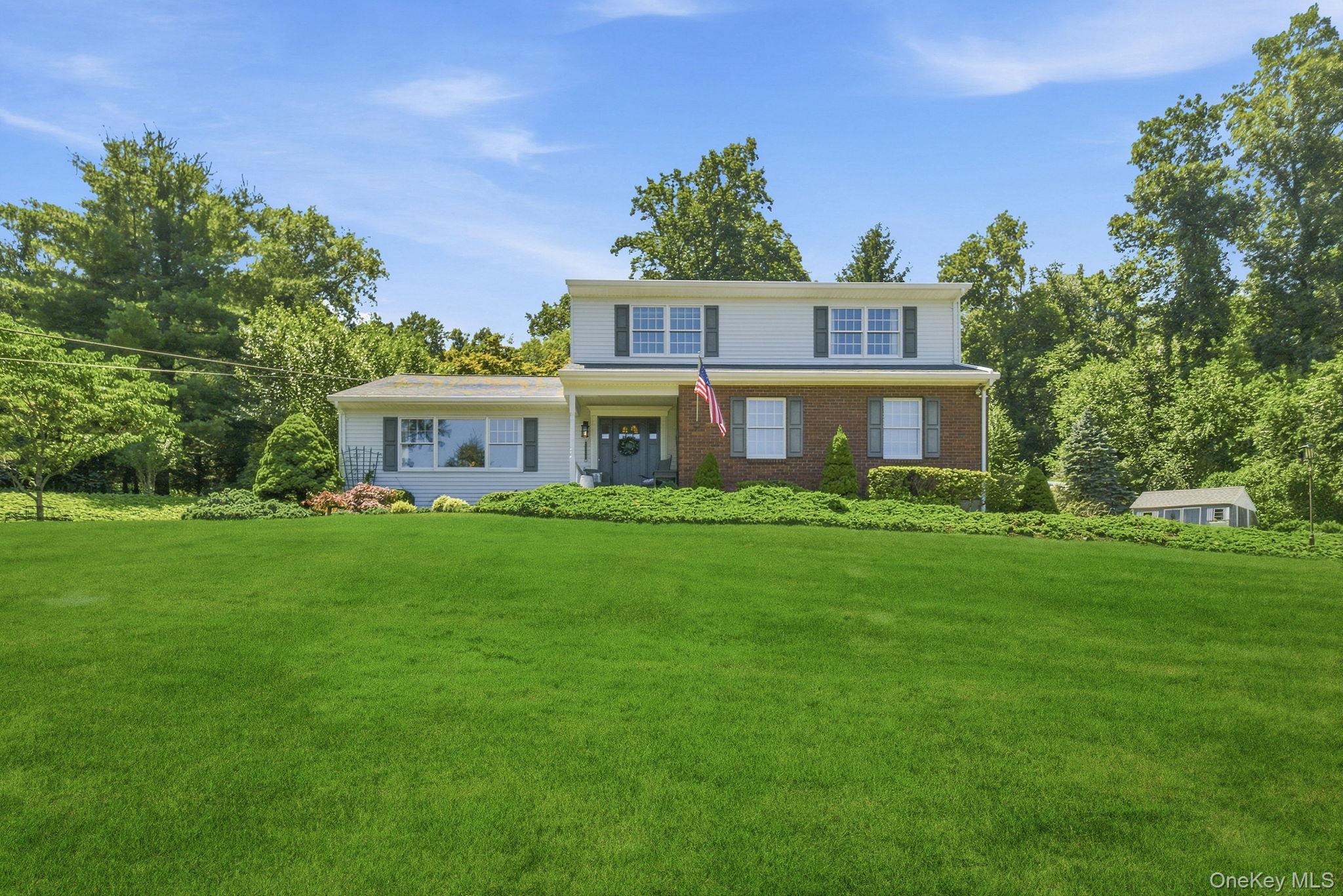 32 Bedell Road Katonah, NY 10536 - Photo 43 of 49 A rolling front lawn and mature landscaping frame the approach.