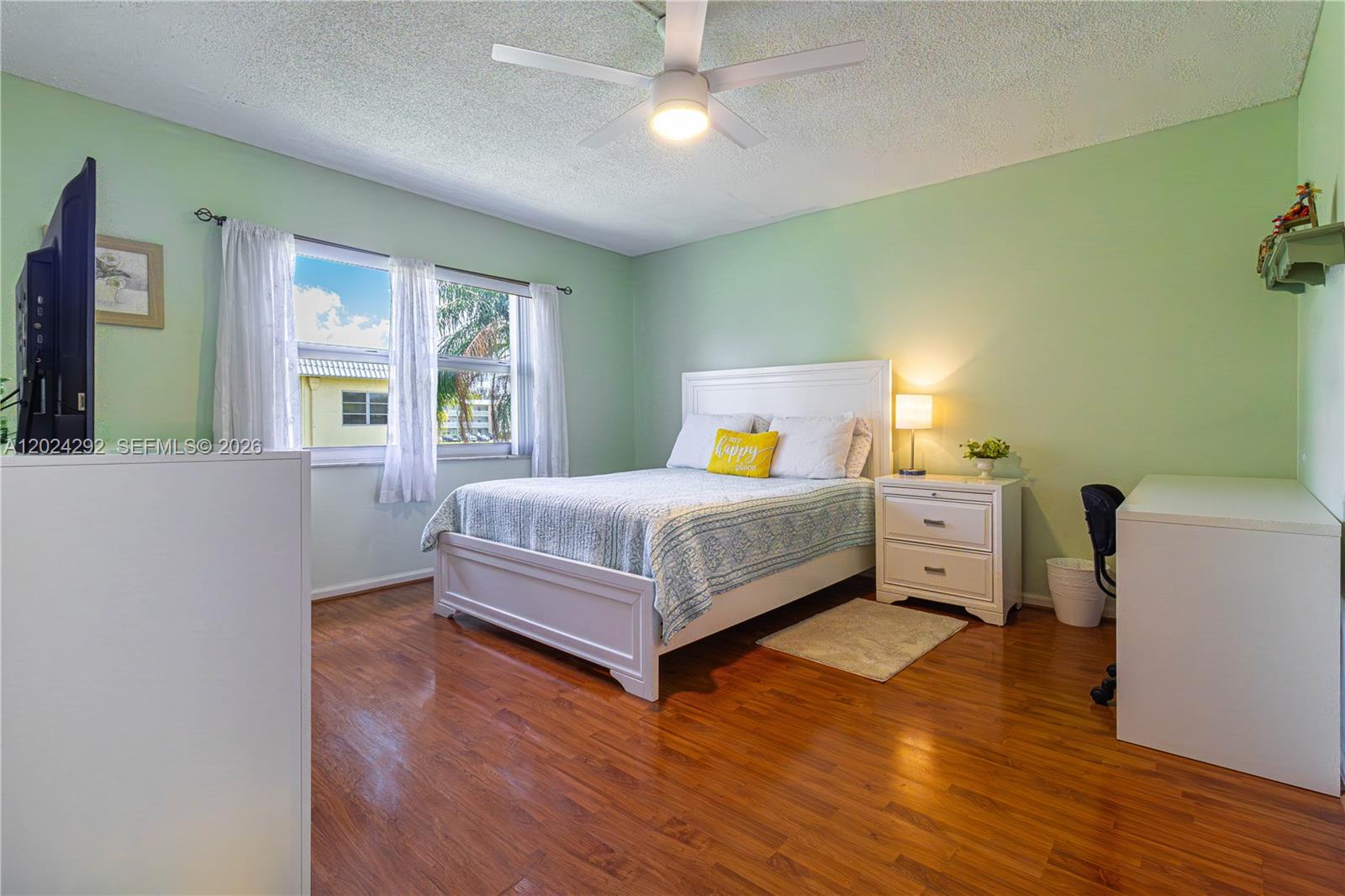 9780 Marina Boulevard, Unit 424 Boca Raton, FL 33428 - Photo 19 of 32 a bedroom with a bed and a window