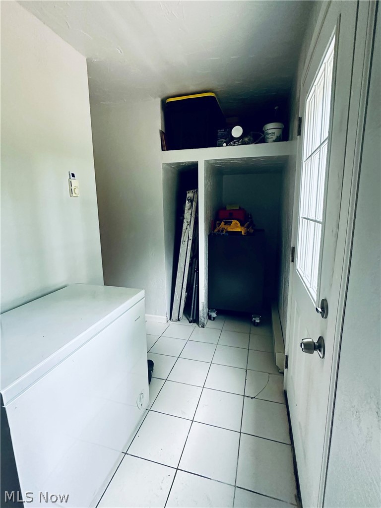 1867 Perth Road Madison, OH 44057 - Photo 22 of 31 Laundry/mudroom featuring storage & rear entryway to fenced in backyard.