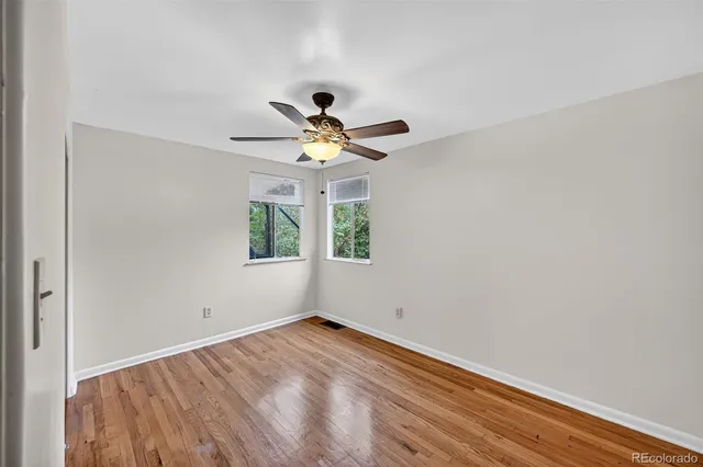 a view of room with window and ceiling fan