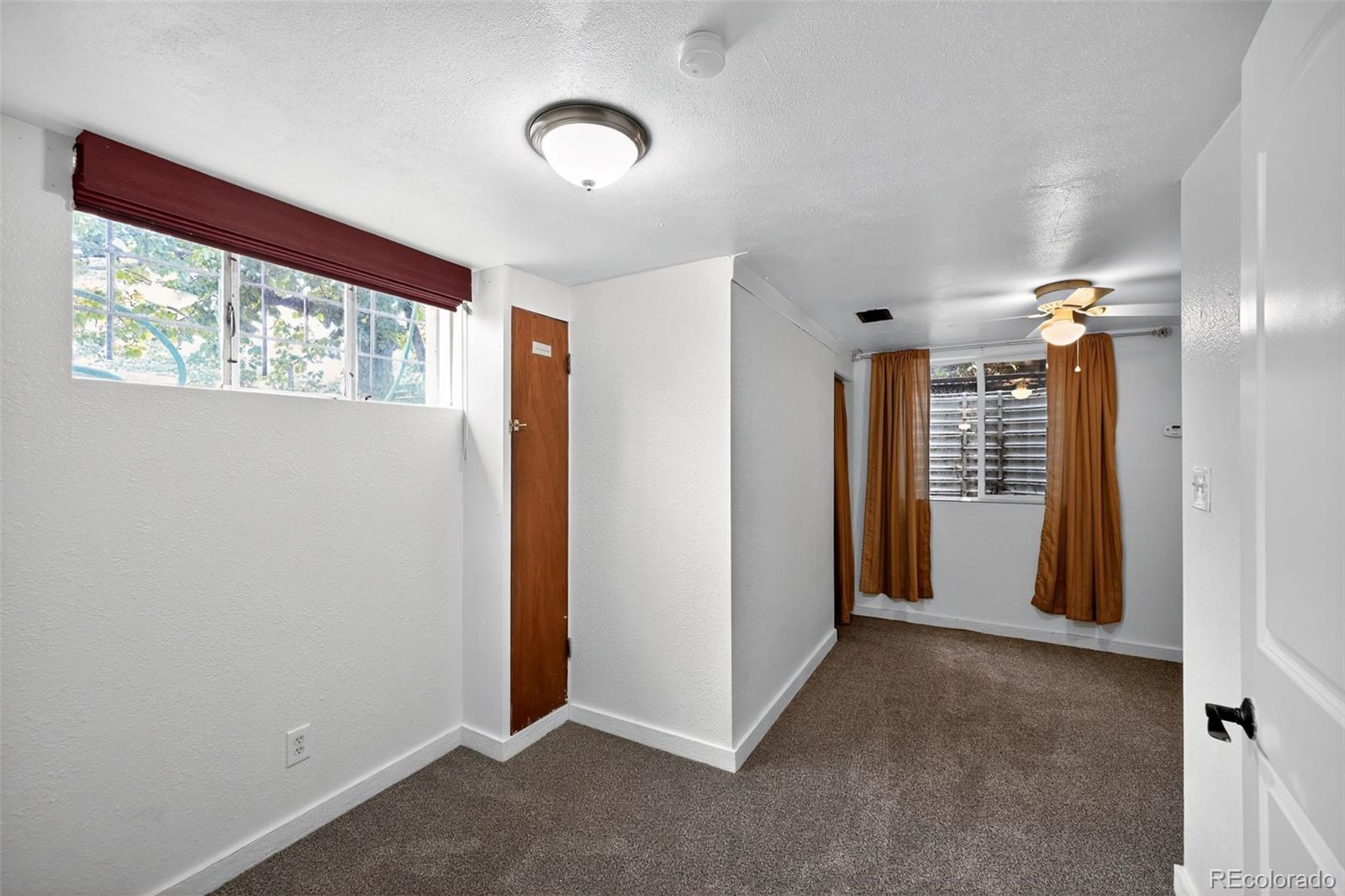 1955 West Virginia Avenue Denver, CO 80223 - Photo 24 of 36 an empty room with windows