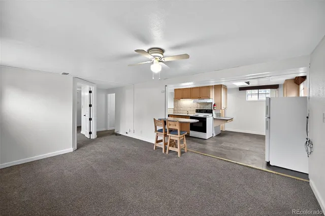 a view of a livingroom with furniture and a window