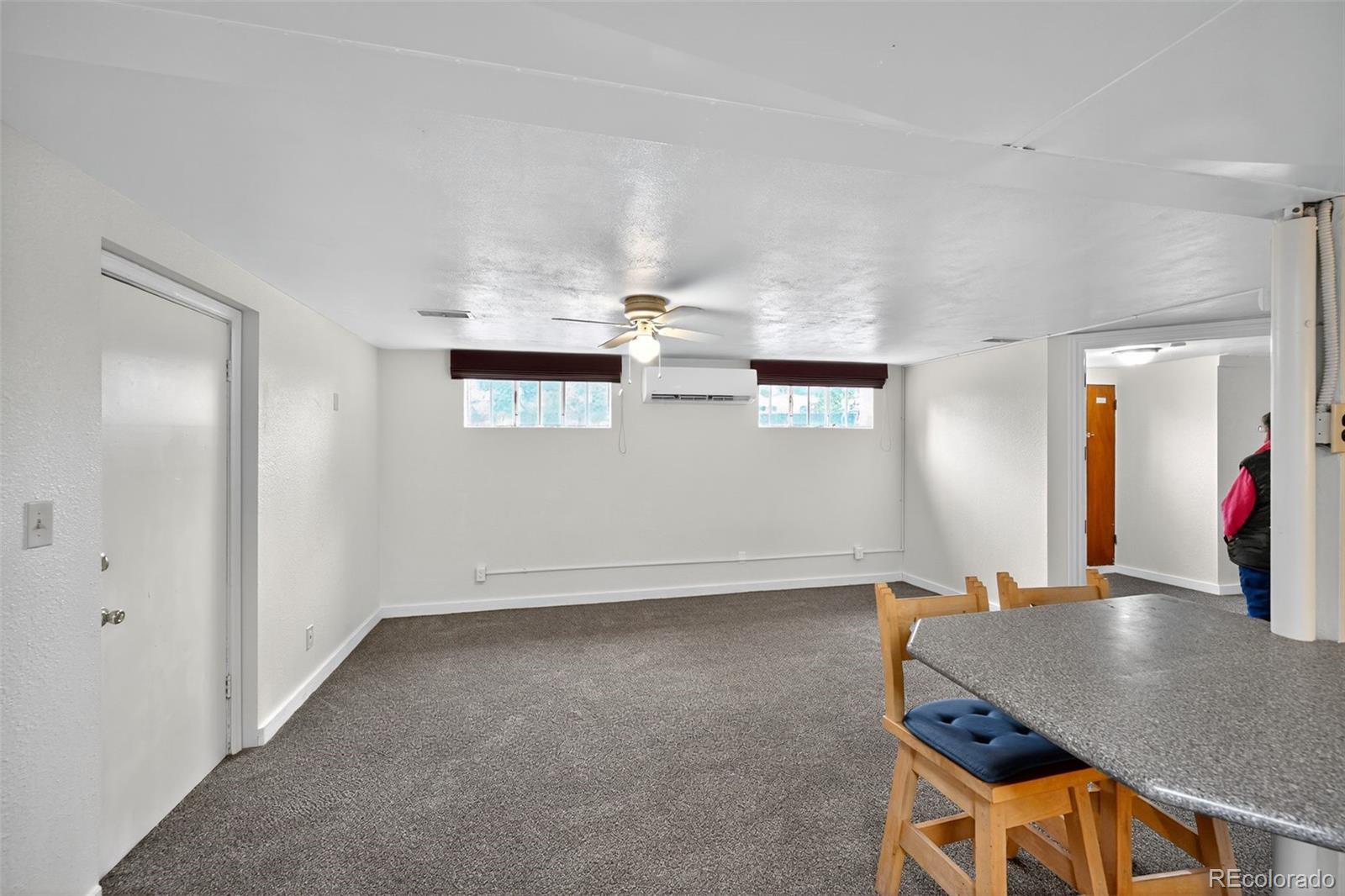 1955 West Virginia Avenue Denver, CO 80223 - Photo 26 of 36 a room with a table and chairs