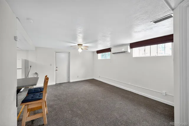 a kitchen with cabinets appliances and a window
