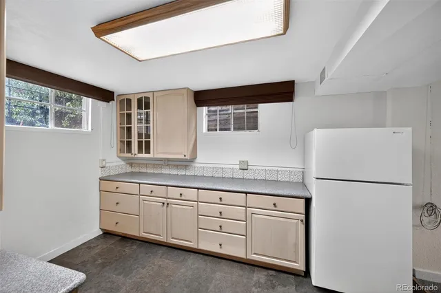a kitchen with stainless steel appliances a stove and a refrigerator
