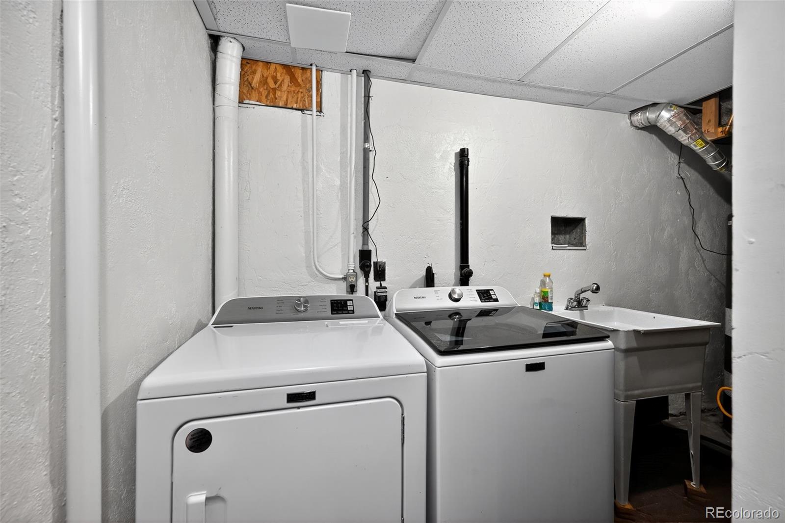 1955 West Virginia Avenue Denver, CO 80223 - Photo 30 of 36 a utility room with dryer and washer