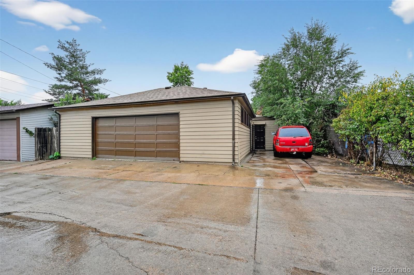 1955 West Virginia Avenue Denver, CO 80223 - Photo 31 of 36 a couple of cars parked in front of a house