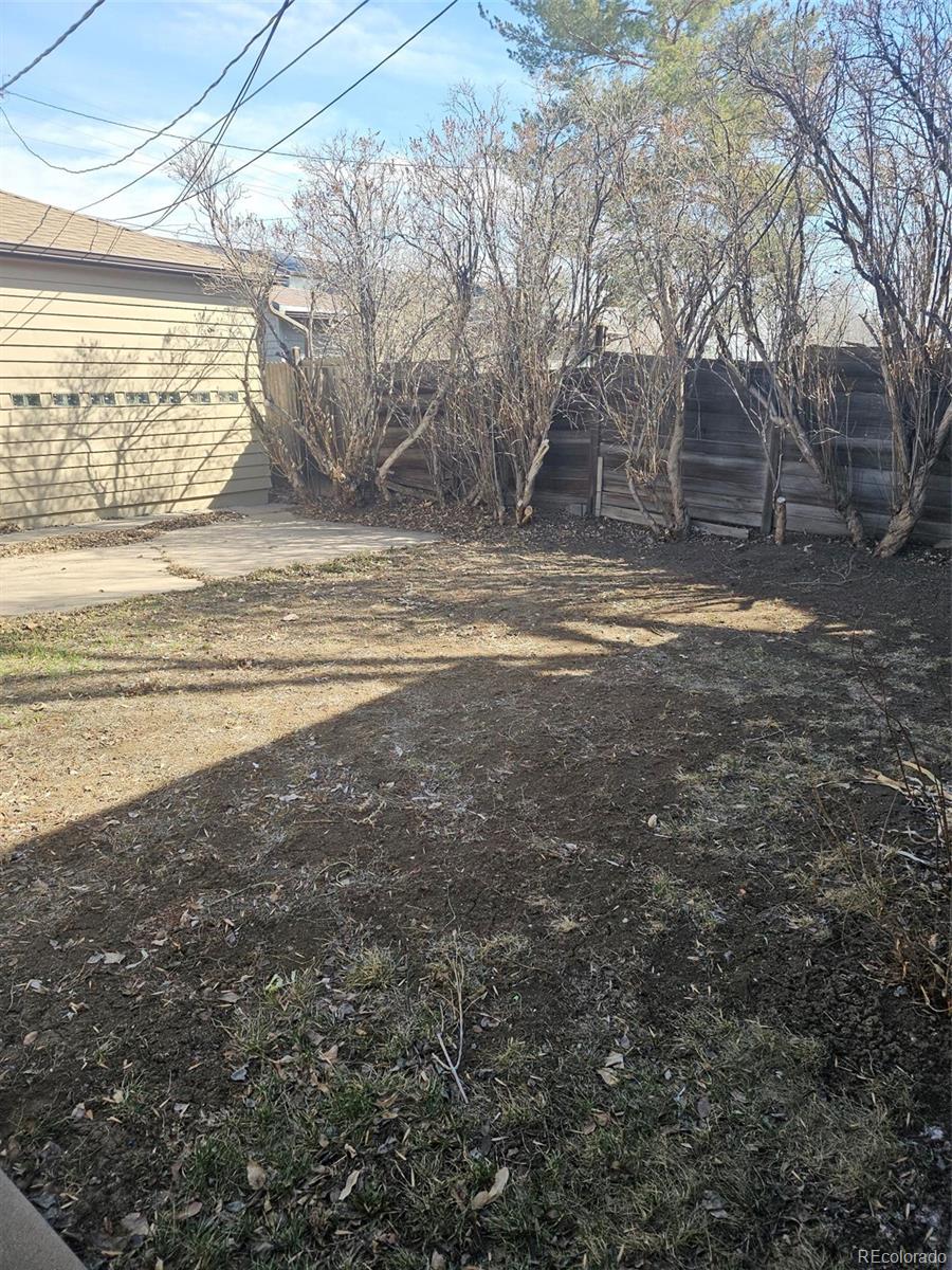 1955 West Virginia Avenue Denver, CO 80223 - Photo 35 of 36 a view of a house with a yard