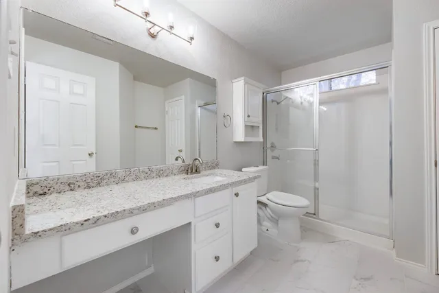 a view of a room with shelf on the wall