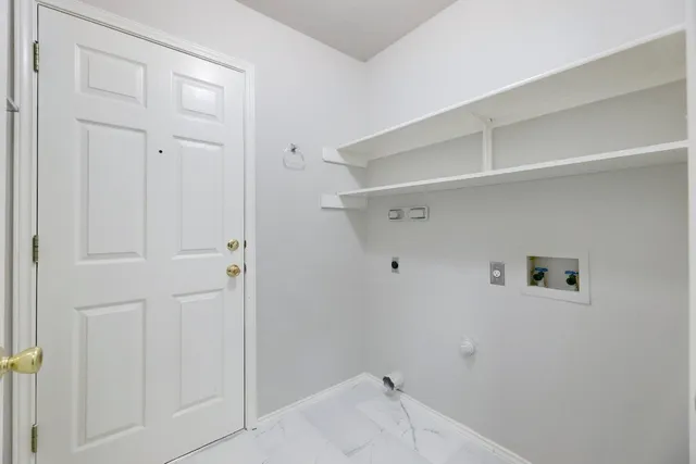 a view of a room with storage and utility room