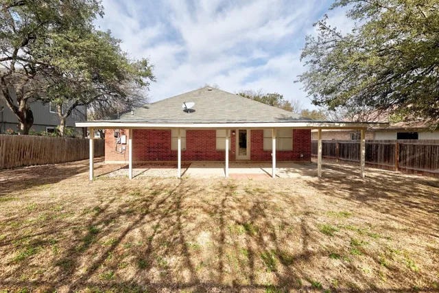 a view of a yard with trees