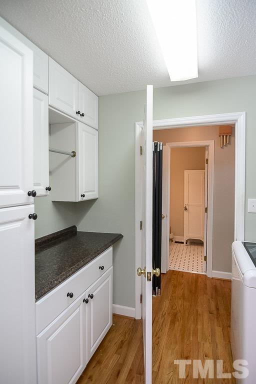 3604 Cranston Road Garner, NC 27529 - Photo 22 of 25 a spacious bathroom with a granite countertop sink and a mirror