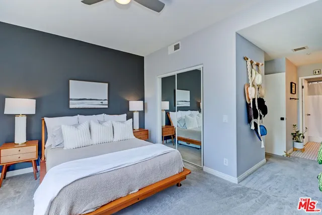 a bed room with a bed and a lamp