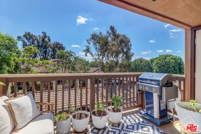 a view of a balcony with chairs