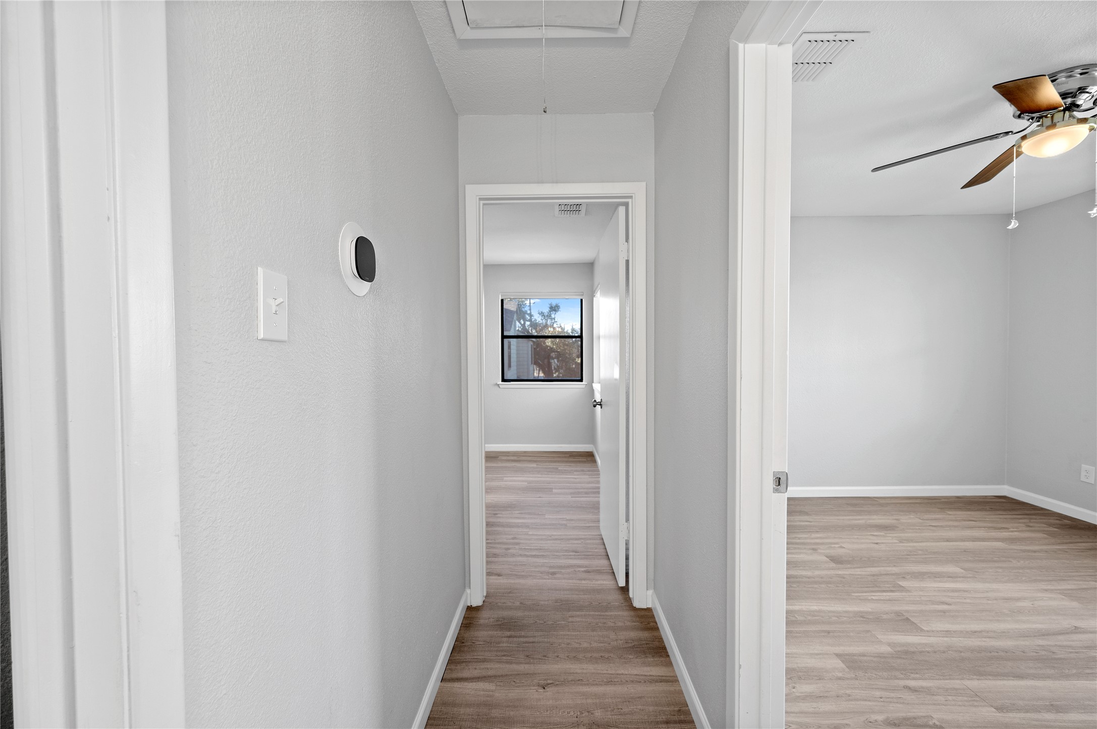 11301 Jollyville Road, Unit B3 Austin, TX 78759 - Photo 13 of 23 Hall featuring attic access and light wood finished floors