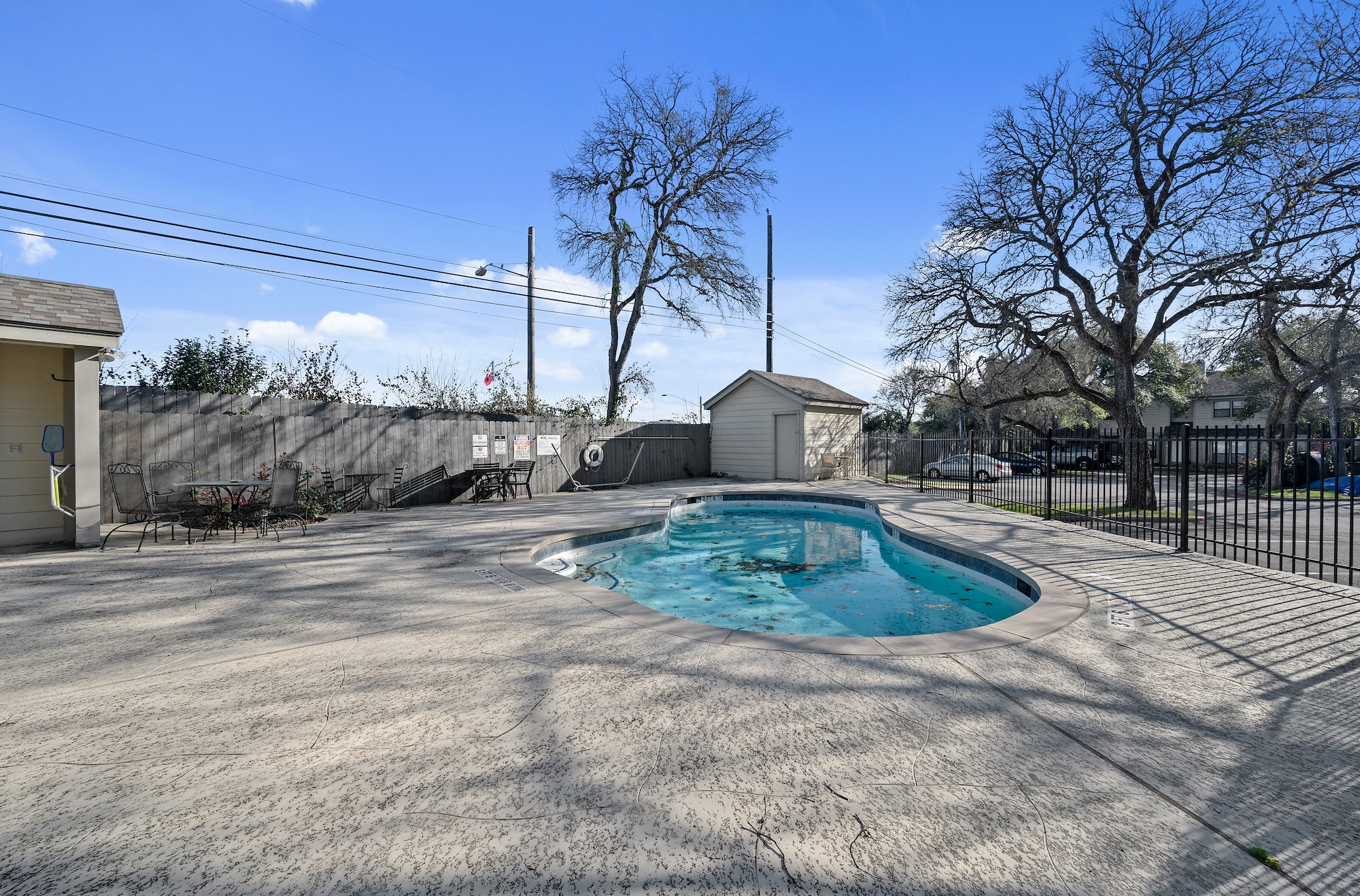 11301 Jollyville Road, Unit B3 Austin, TX 78759 - Photo 22 of 23 View of swimming pool with a fenced backyard, a patio, and a storage shed