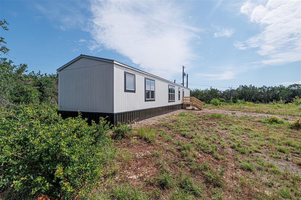 4510 Tennessee Trail Granbury, TX 76048 - Photo 2 of 25 a view of a house with a yard