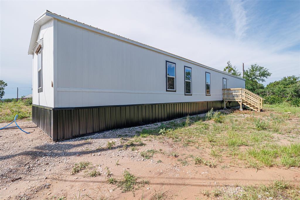 4510 Tennessee Trail Granbury, TX 76048 - Photo 24 of 25 a view of a house with a wooden fence