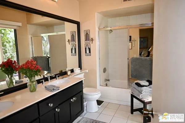 a bathroom with a toilet and shower