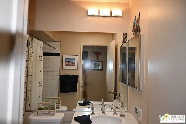 a bedroom with bed and a window