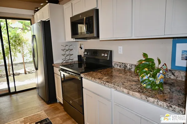 a kitchen with sink and cabinets