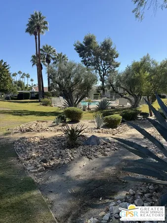 a view of a lake with a yard