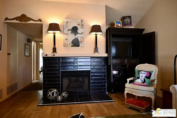 a view of outdoor kitchen with seating area