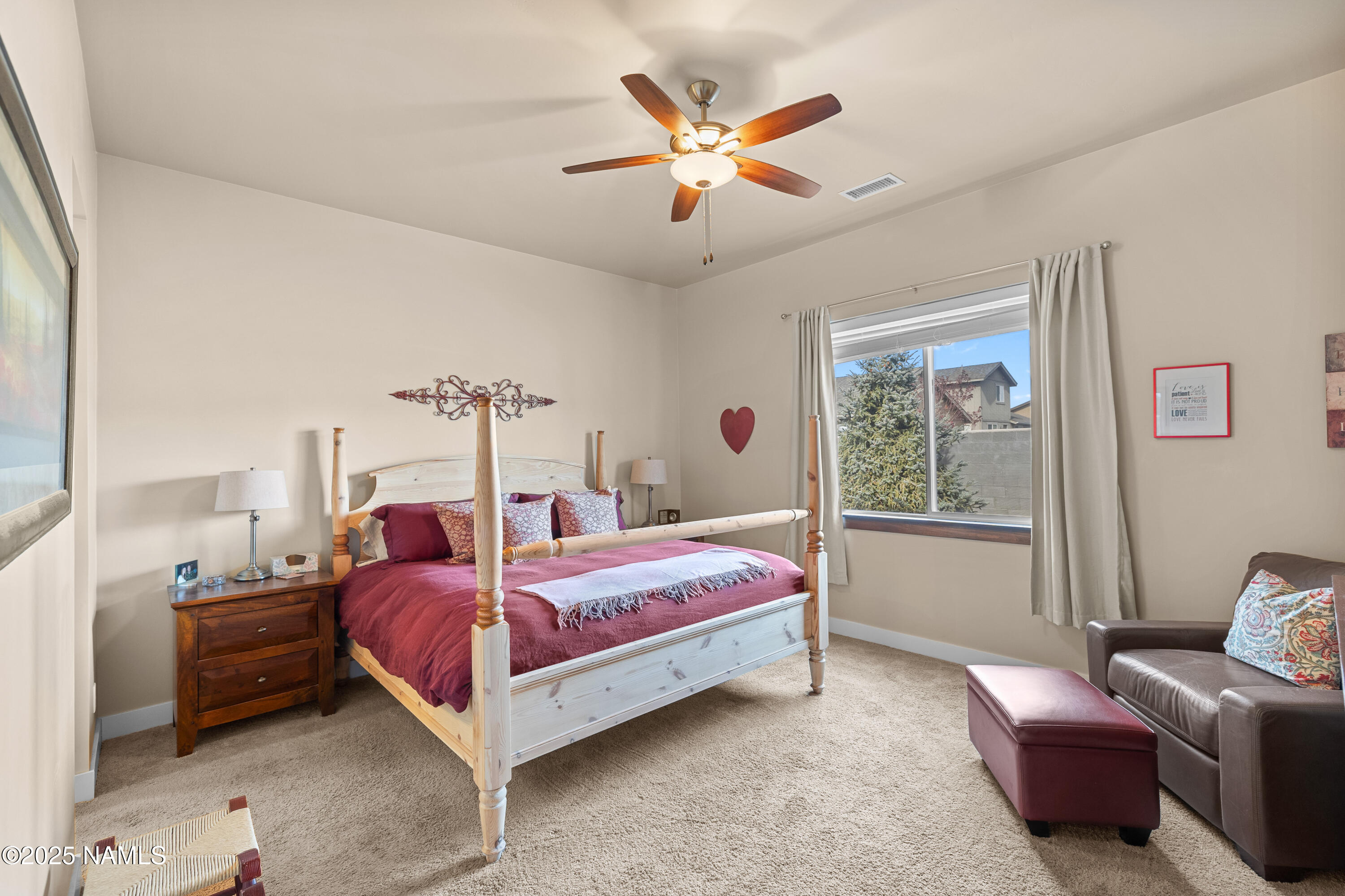 12030 Hydrus Road Bellemont, AZ 86015 - Photo 11 of 30 a bed room with a bed and a window