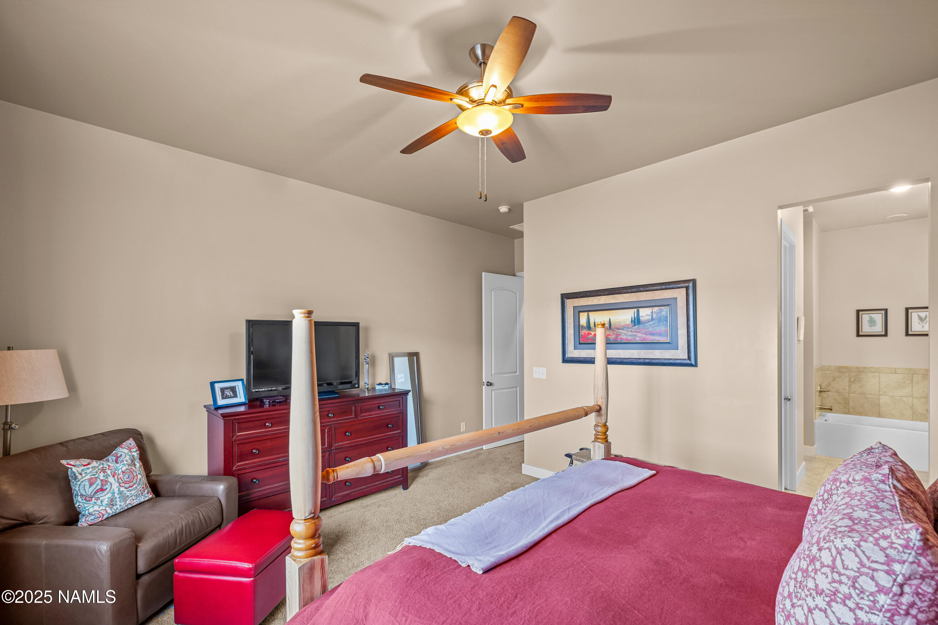 12030 Hydrus Road Bellemont, AZ 86015 - Photo 13 of 30 a bedroom with a bed and a couch