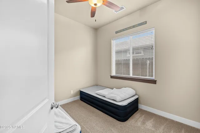 a living room with a couch and a window