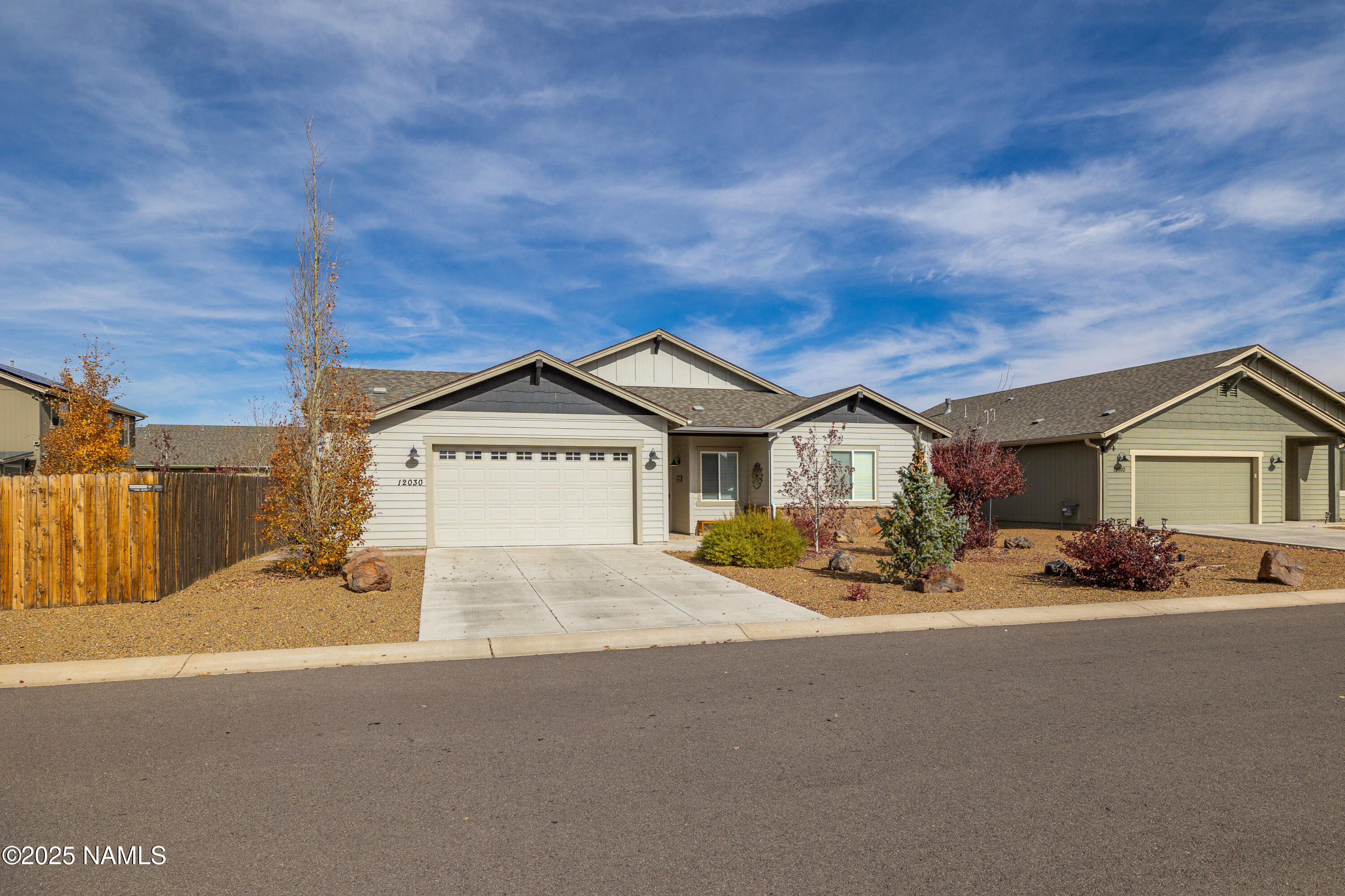 12030 Hydrus Road Bellemont, AZ 86015 - Photo 24 of 30 a view of a house with a yard and large tree