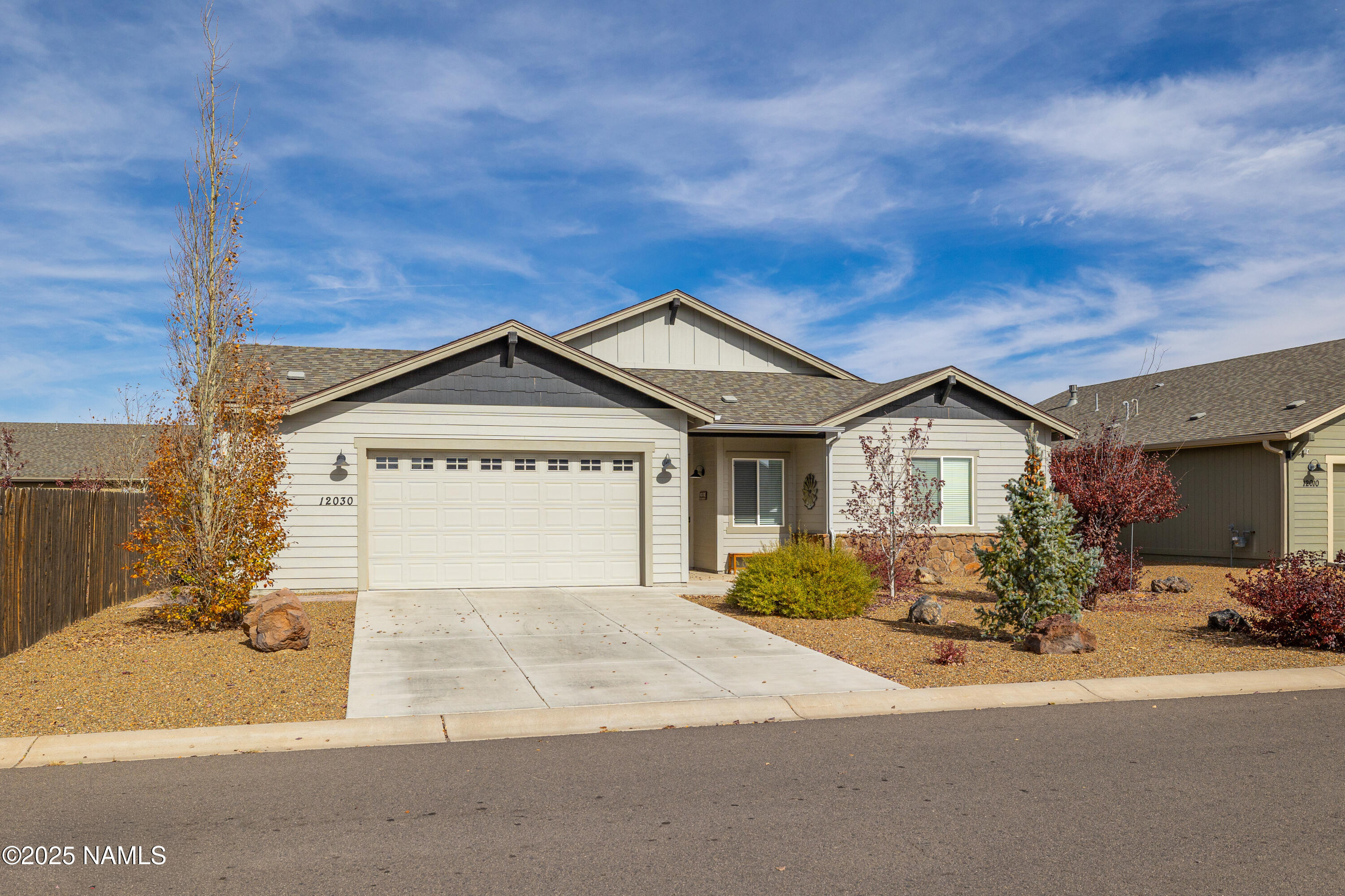 12030 Hydrus Road Bellemont, AZ 86015 - Photo 25 of 30 a view of a house with a yard and potted plants