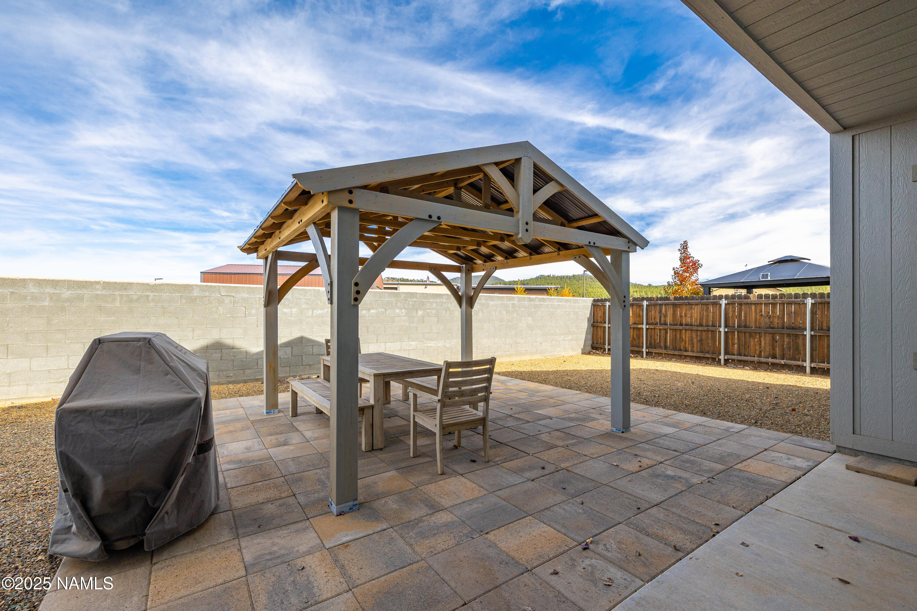 12030 Hydrus Road Bellemont, AZ 86015 - Photo 27 of 30 a roof deck with table and chairs