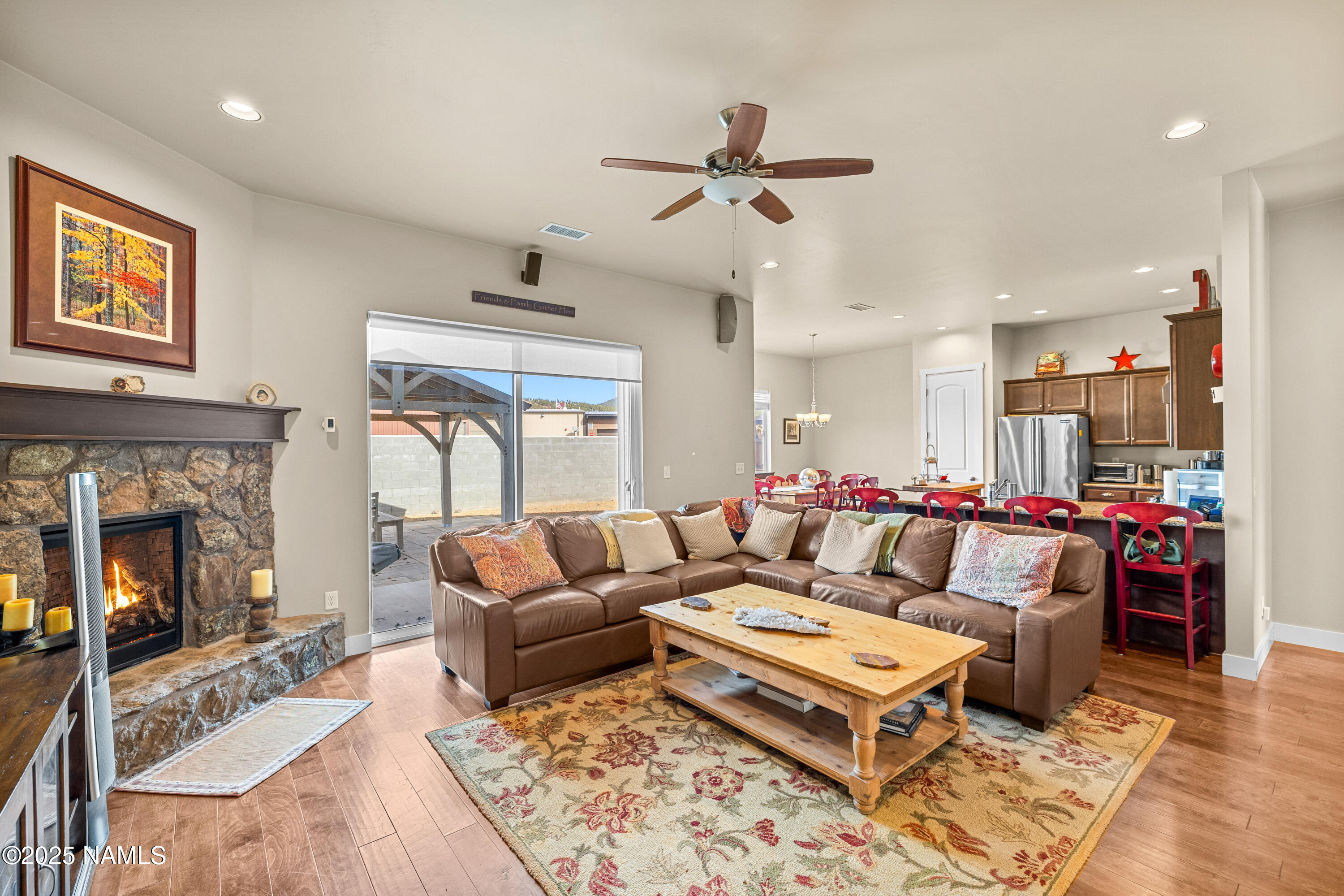 12030 Hydrus Road Bellemont, AZ 86015 - Photo 5 of 30 a living room with furniture and a fireplace
