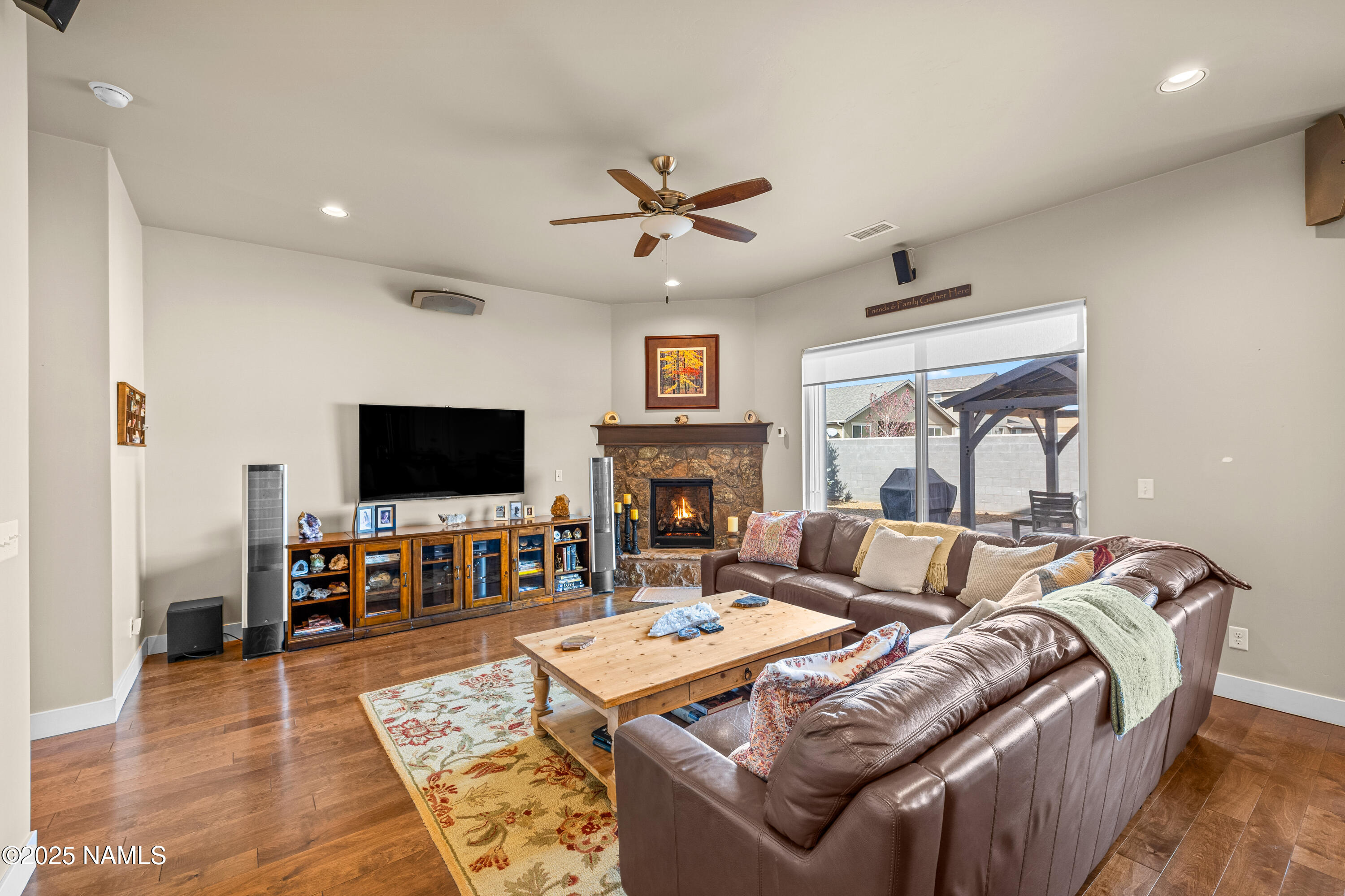 12030 Hydrus Road Bellemont, AZ 86015 - Photo 6 of 30 a living room with fireplace furniture and a flat screen tv