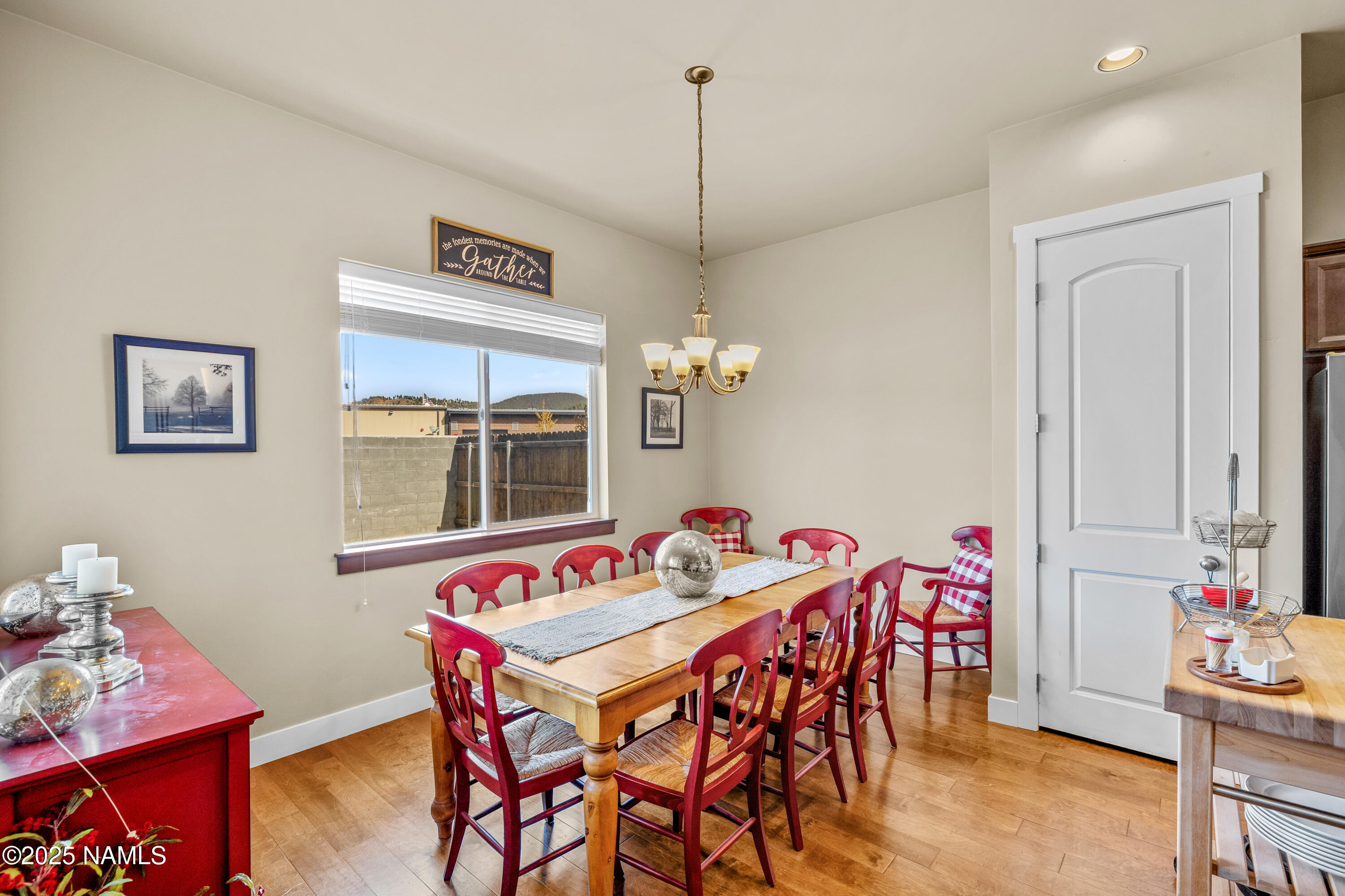 12030 Hydrus Road Bellemont, AZ 86015 - Photo 10 of 30 a dining room with furniture and wooden floor