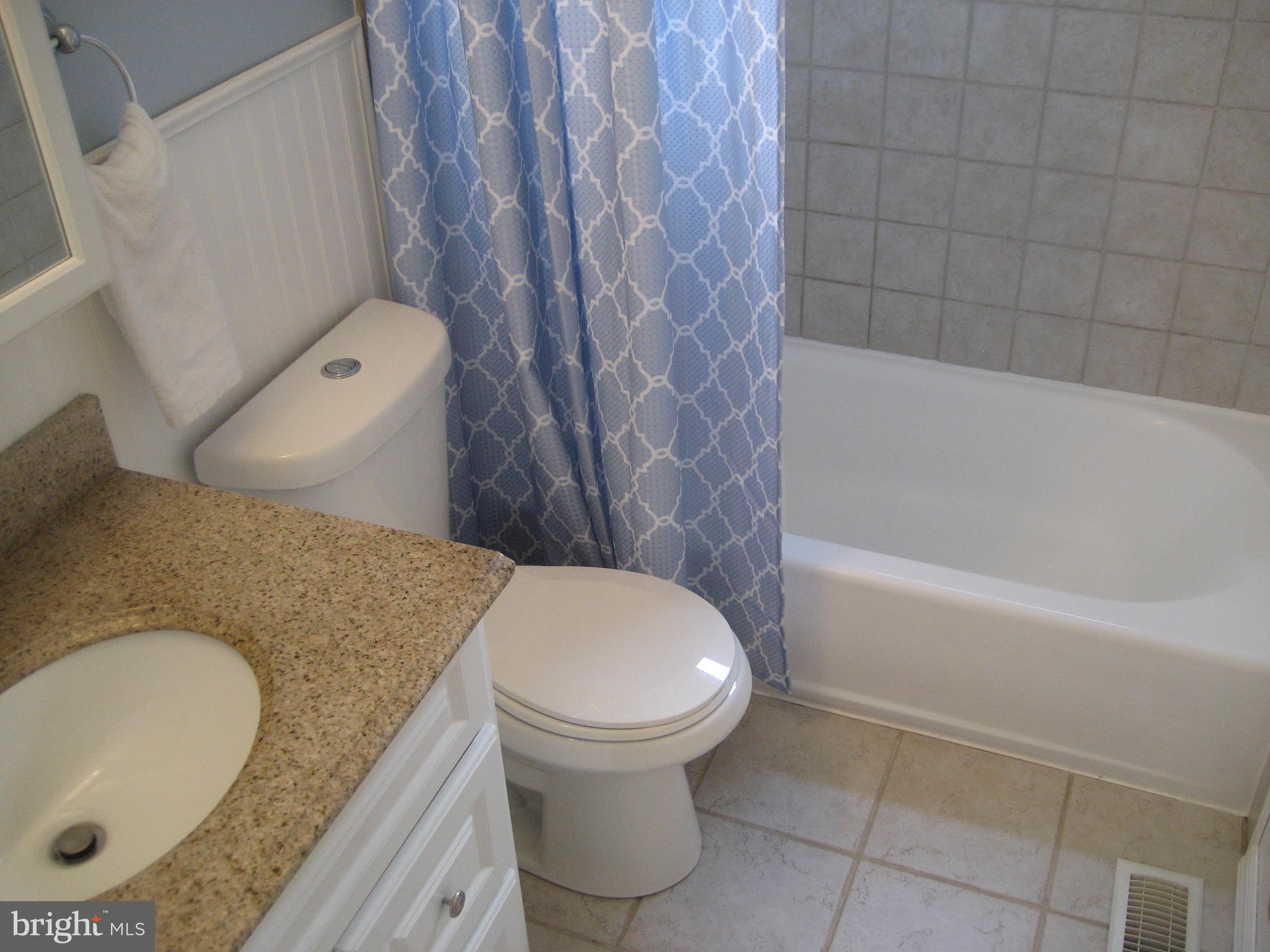28 Beaumont Road Hamilton, NJ 08620 - Photo 15 of 26 Granite counter, tile floor & tub surround.