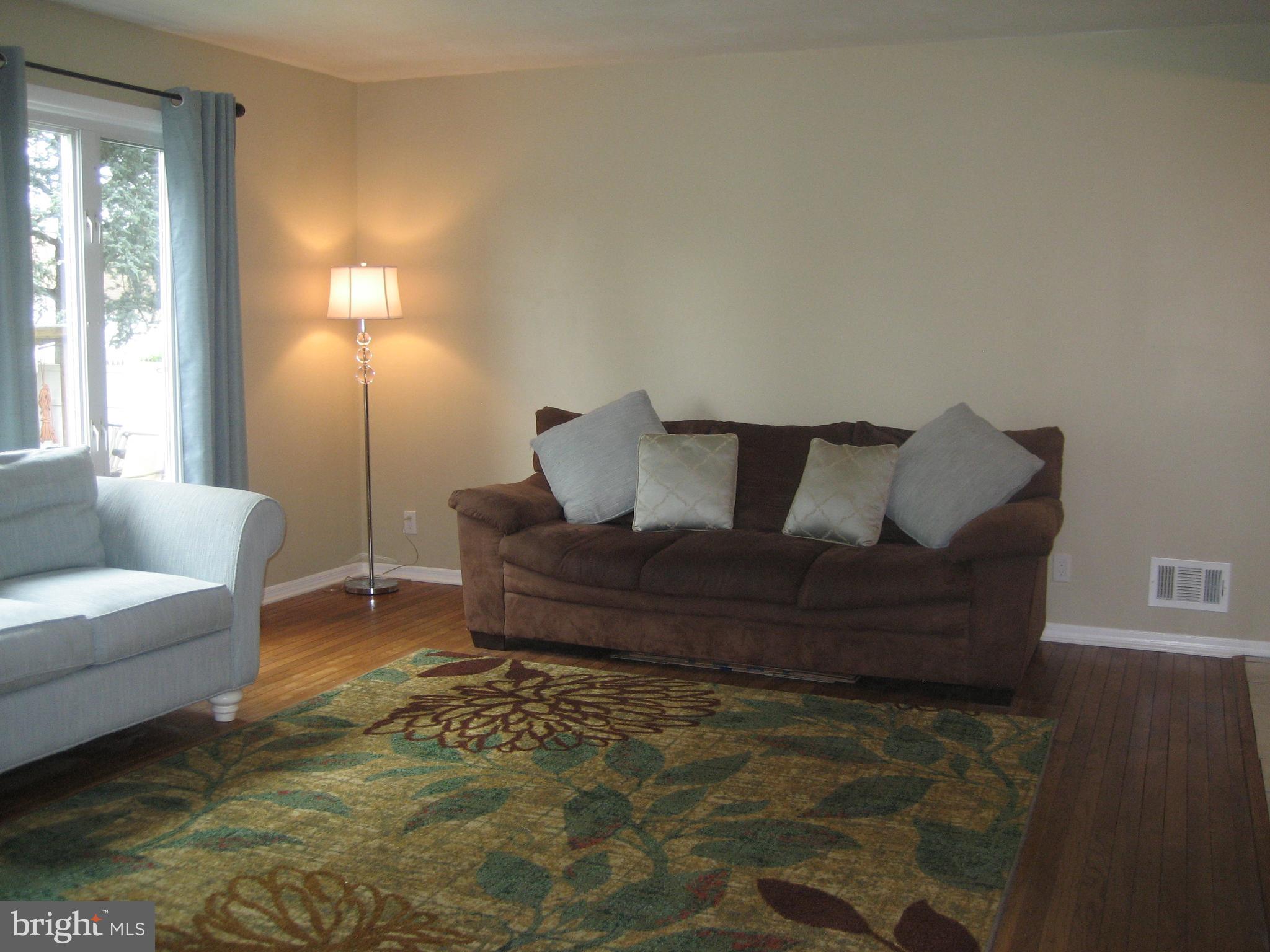 28 Beaumont Road Hamilton, NJ 08620 - Photo 7 of 26 Spacious living room with hardwood flooring.