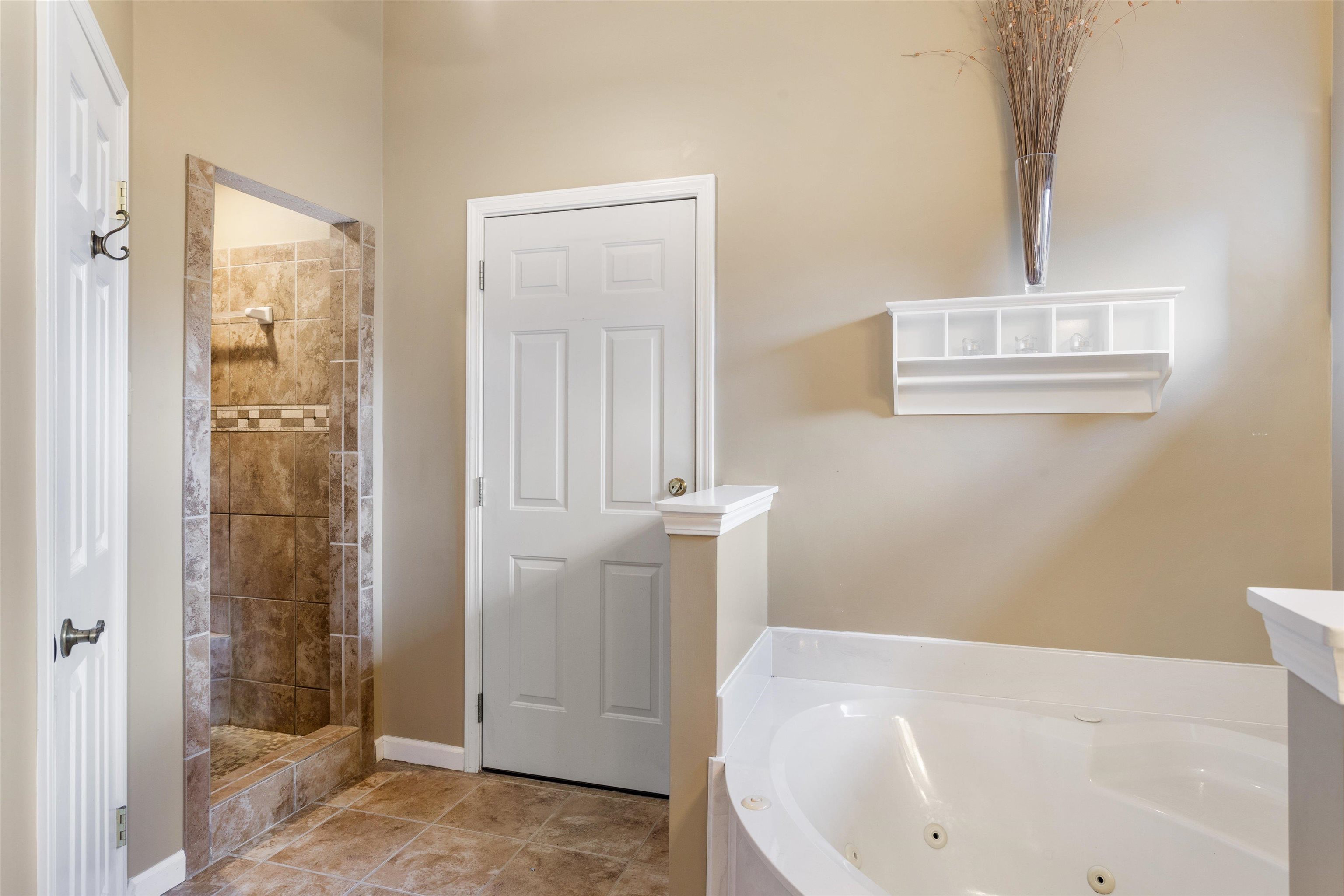 6614 Stephan Ridge Cove Bartlett, TN 38135 - Photo 12 of 26 a bathroom with a bathtub and shower