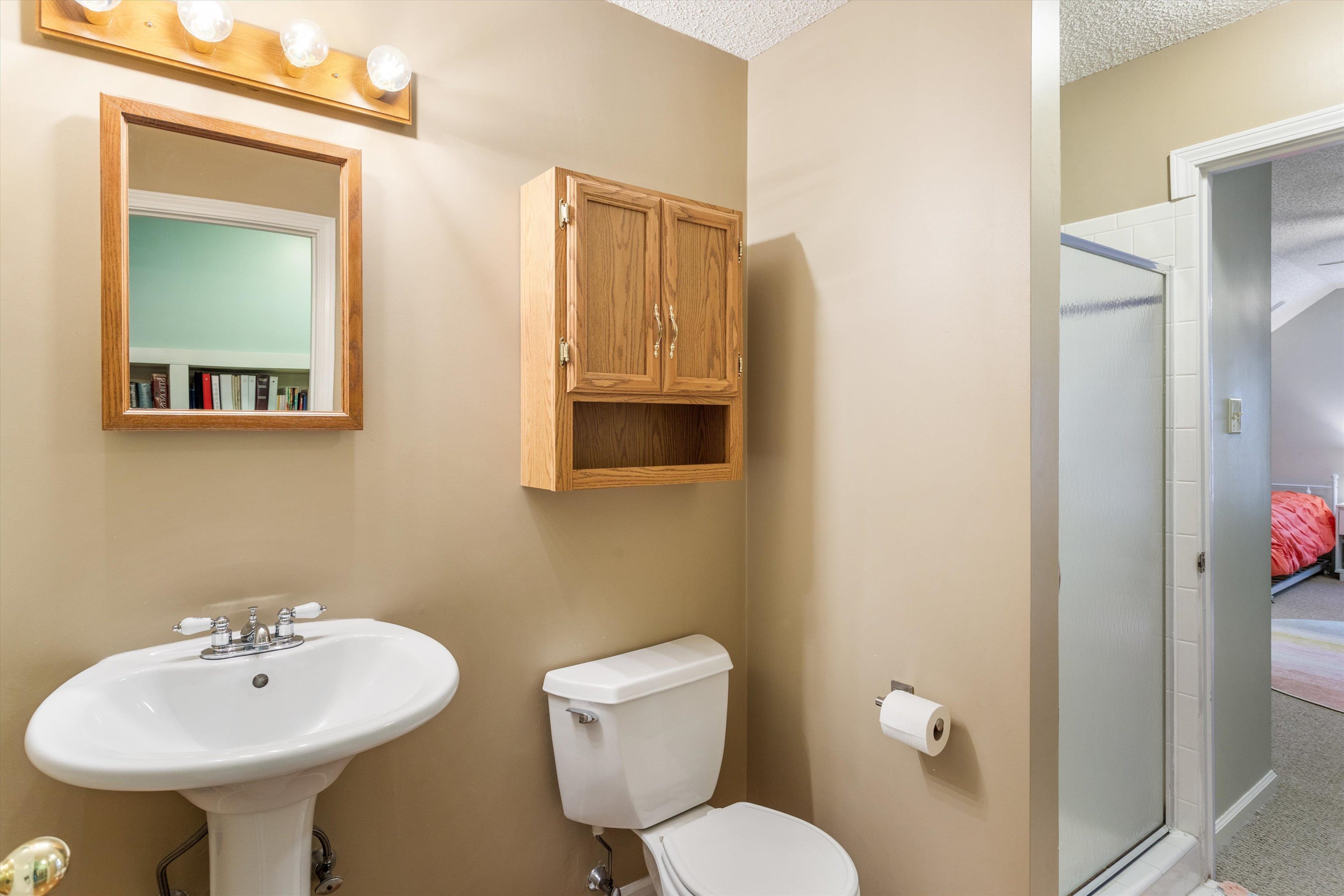 6614 Stephan Ridge Cove Bartlett, TN 38135 - Photo 18 of 26 a bathroom with a toilet sink and mirror