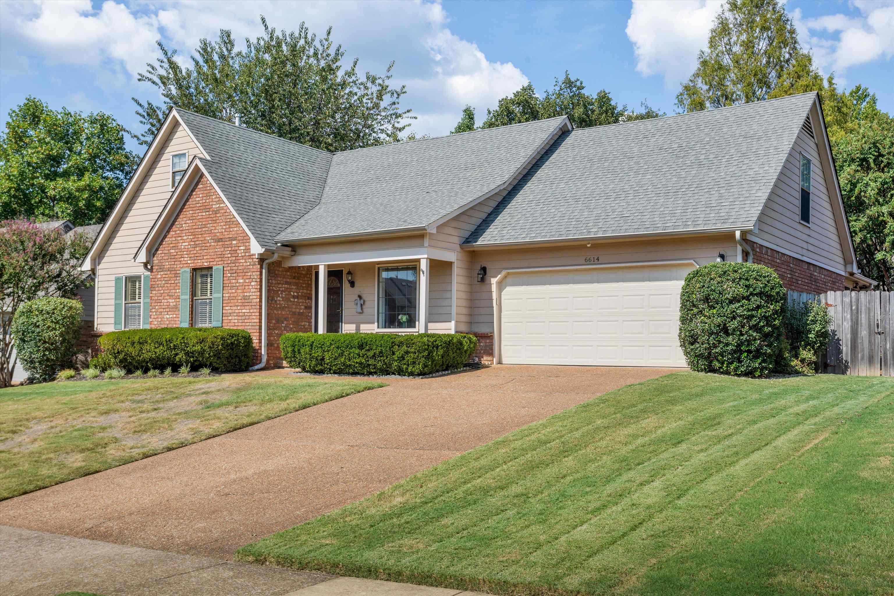 6614 Stephan Ridge Cove Bartlett, TN 38135 - Photo 2 of 26 a front view of a house with a yard