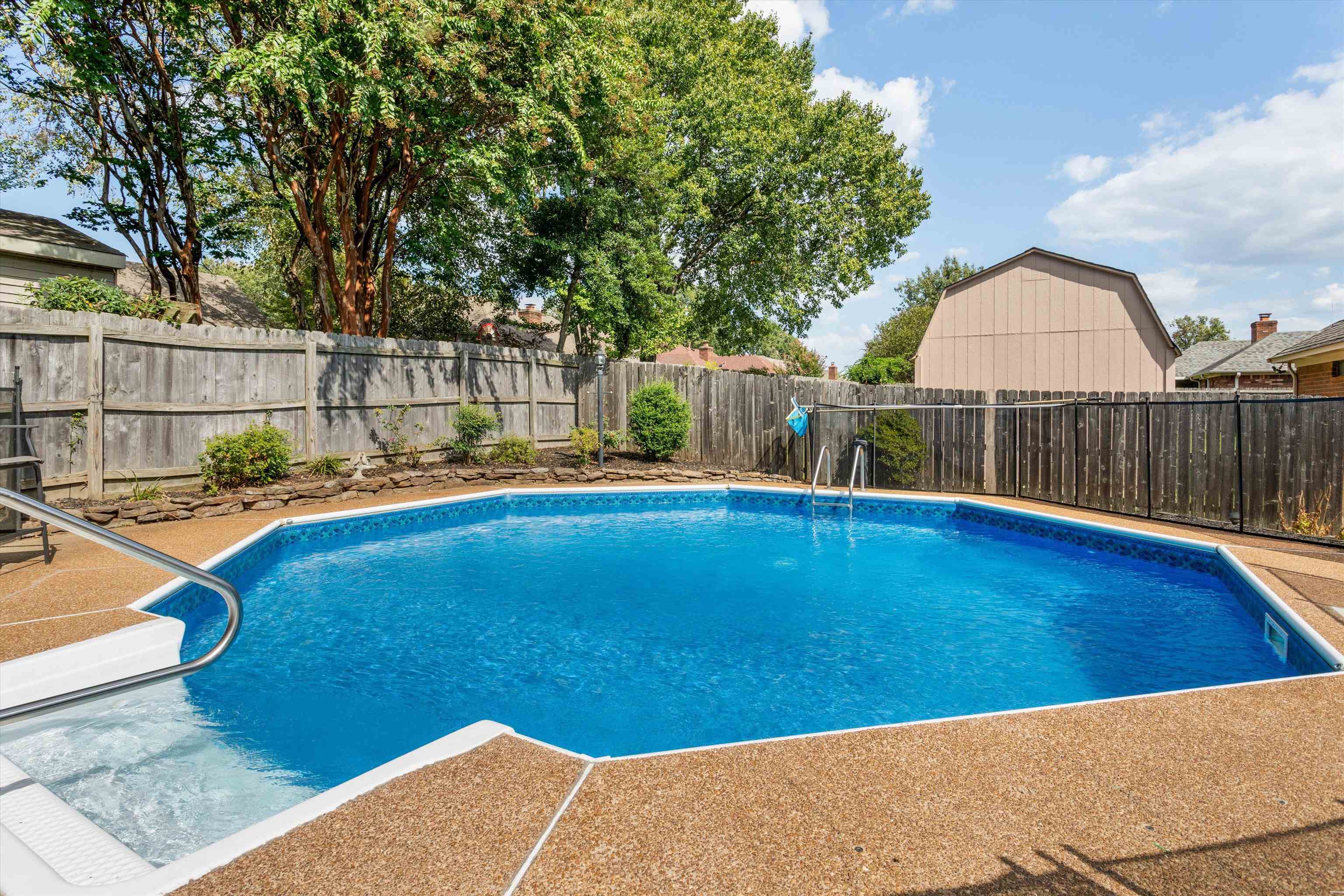 6614 Stephan Ridge Cove Bartlett, TN 38135 - Photo 23 of 26 a view of a swimming pool with a lounge chairs