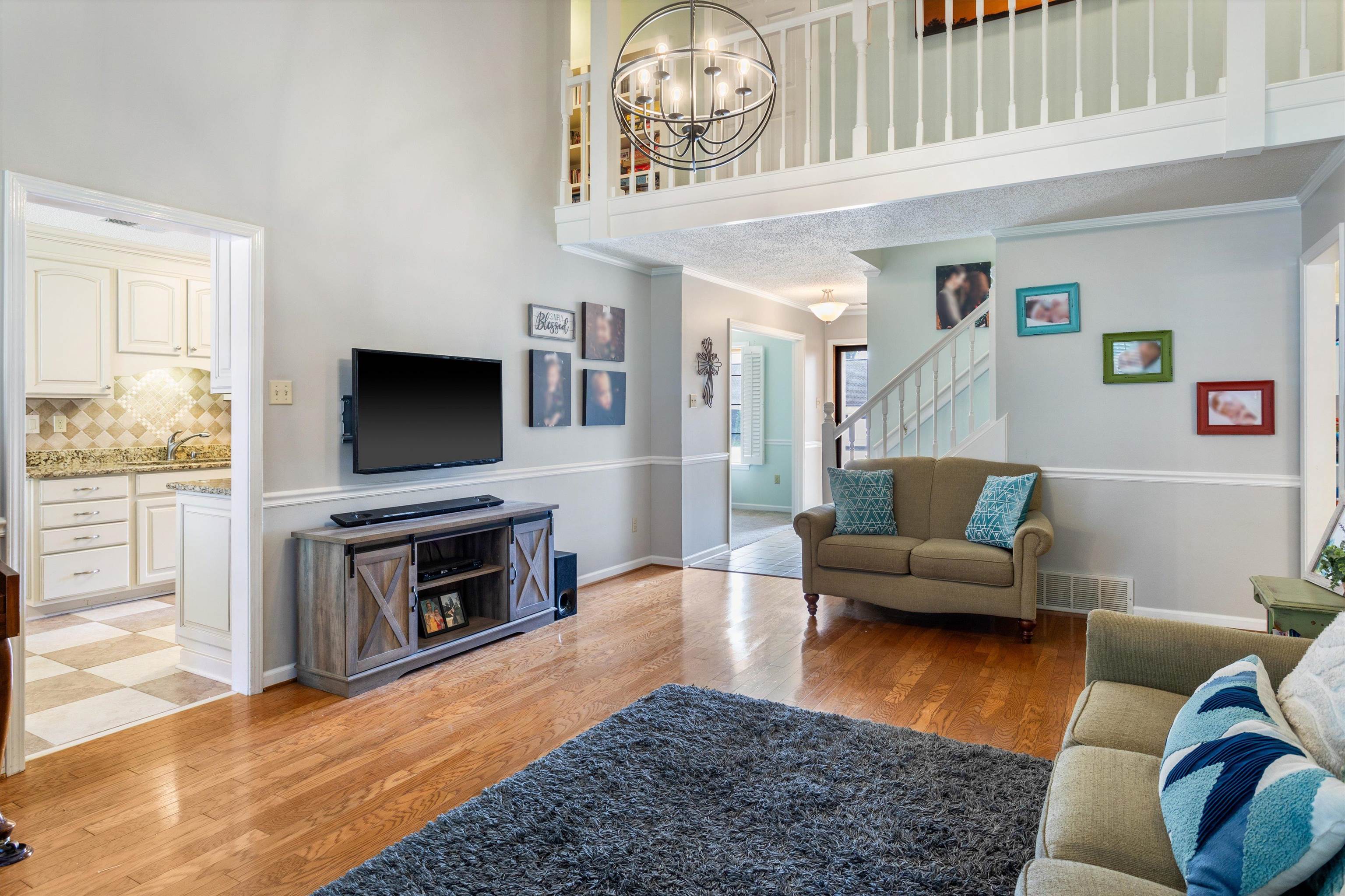 6614 Stephan Ridge Cove Bartlett, TN 38135 - Photo 5 of 26 a living room with furniture and a flat screen tv