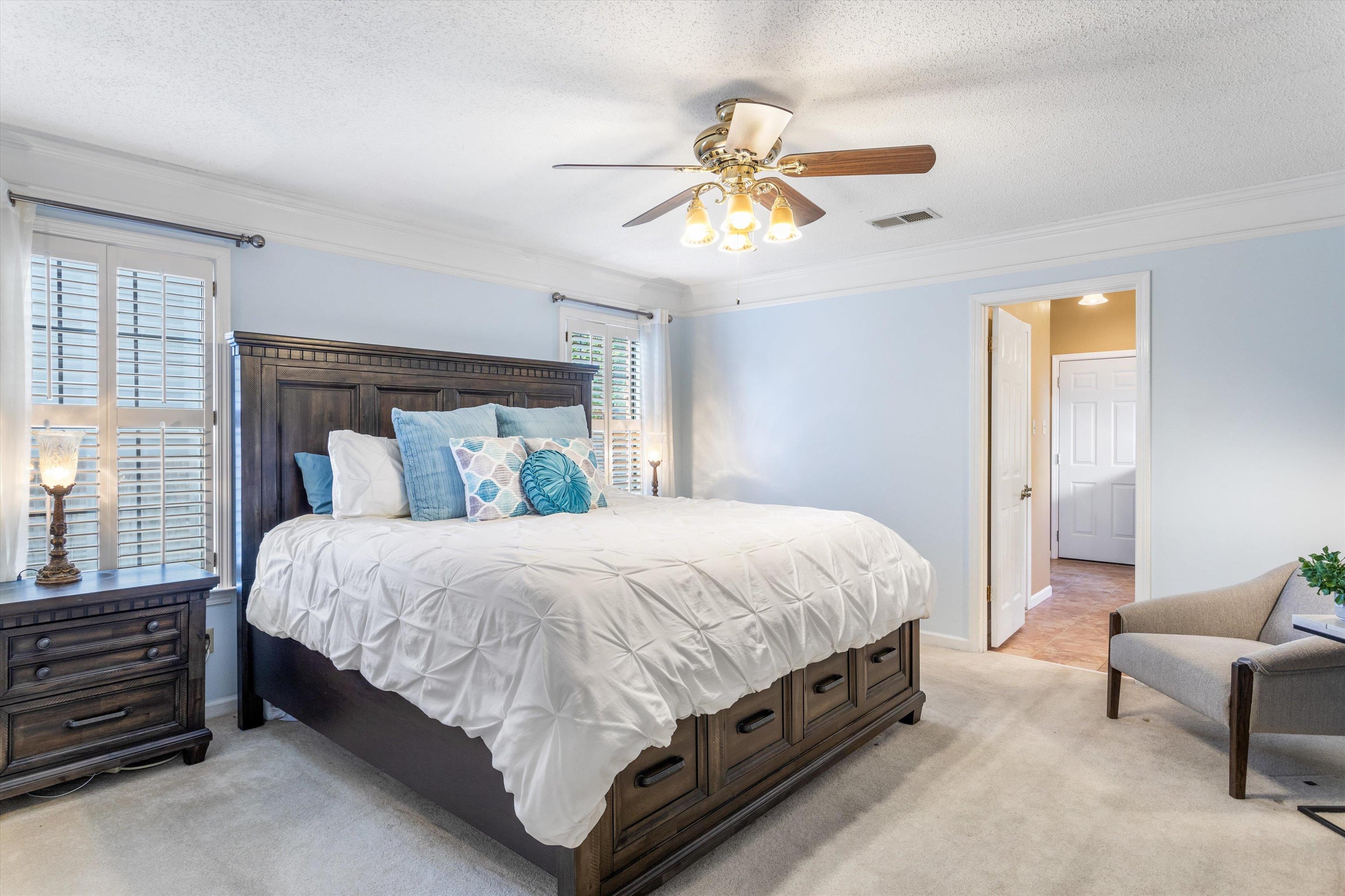 6614 Stephan Ridge Cove Bartlett, TN 38135 - Photo 10 of 26 a spacious bedroom with a bed and a chandelier