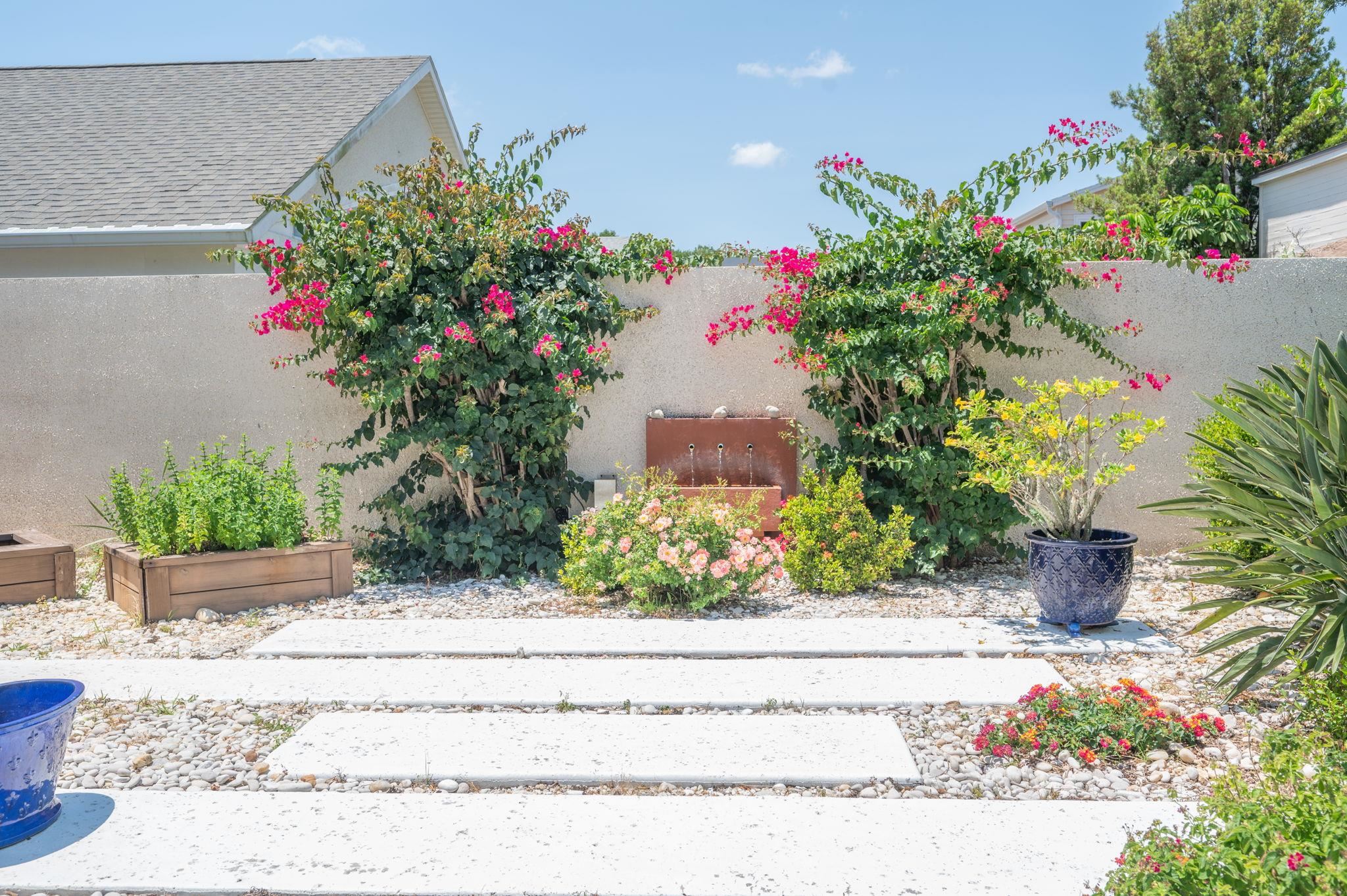 322 Monika Place St. Augustine, FL 32080 - Photo 42 of 55 a potted plant sitting in front of a house