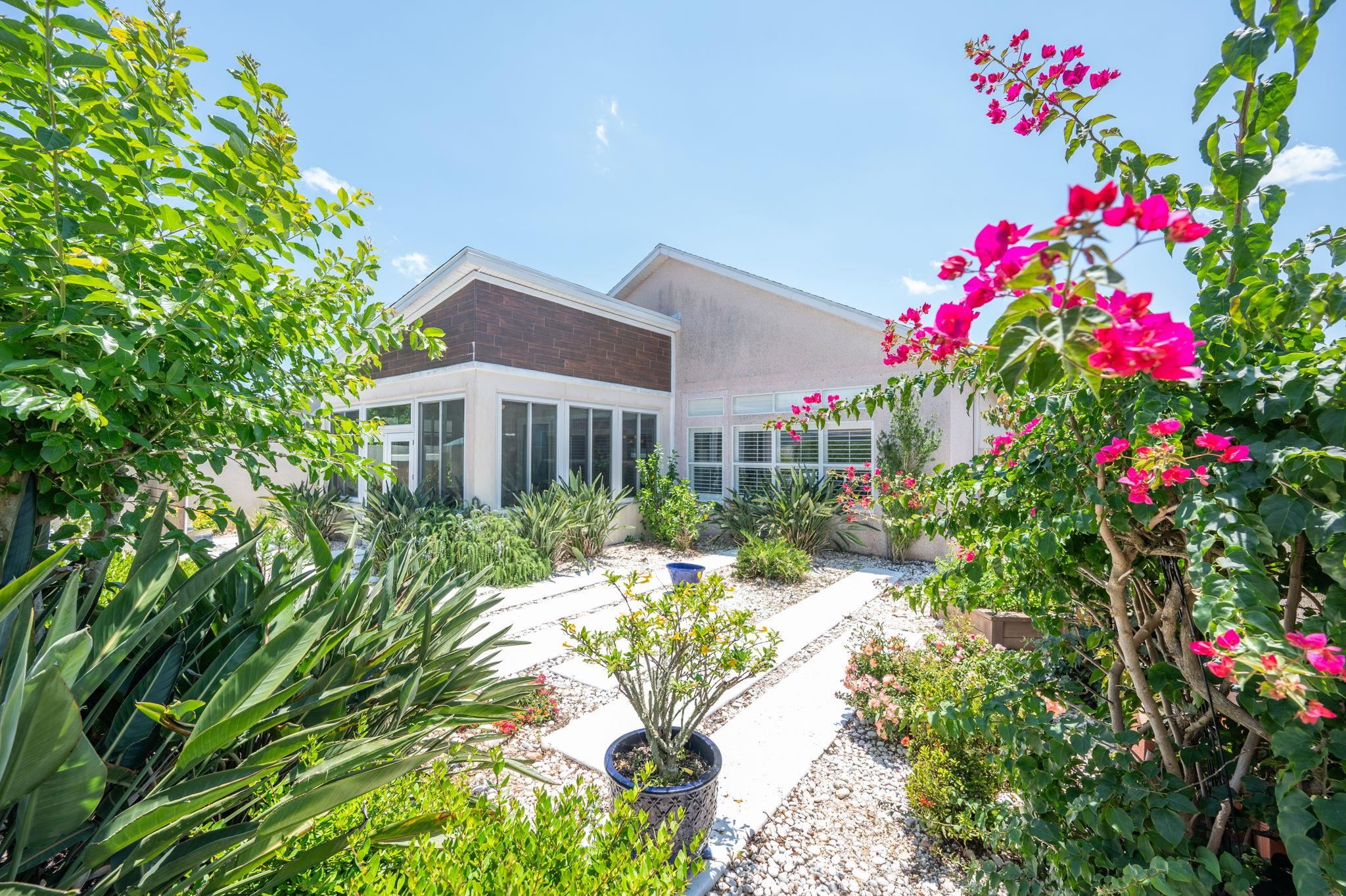 322 Monika Place St. Augustine, FL 32080 - Photo 51 of 55 a flower garden in front of a house