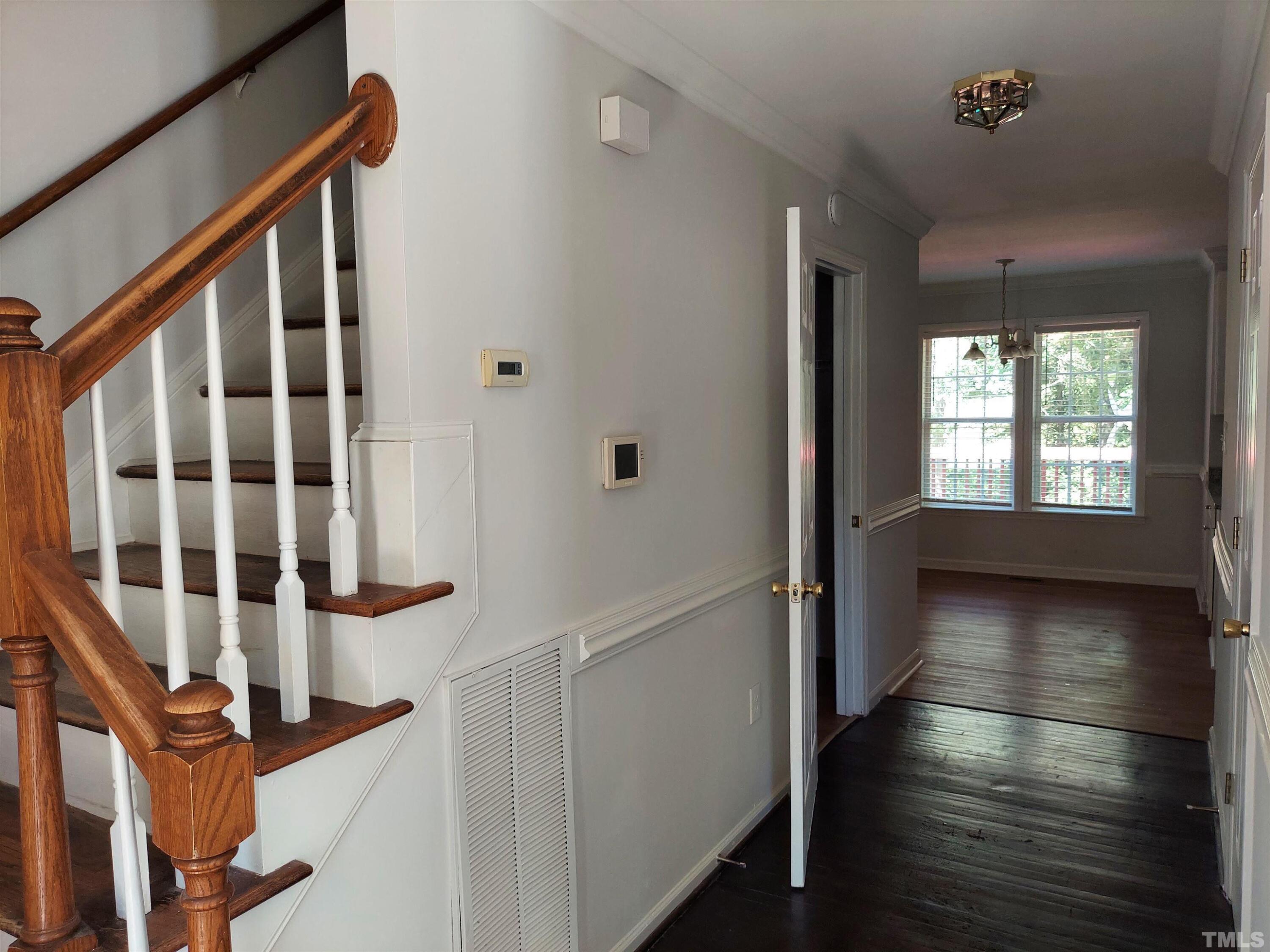 224 Crossfire Road Holly Springs, NC 27540 - Photo 16 of 43 a view of staircase with lots of wooden floor and windows